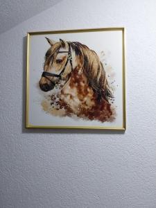 a painting of a horse on a wall at Park Apartment in Kochani