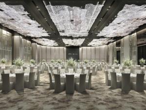 a banquet hall with white tables and chairs at The Ambassador Seoul - A Pullman Hotel in Seoul +117 photos