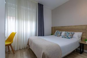 Postel nebo postele na pokoji v ubytování IRAIPE Gorbea Auto Check-in