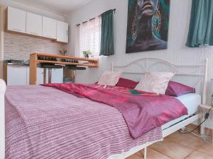 a bedroom with a large bed and a piano at Apartman Jezz II, Zagreb in Zagreb