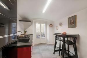 a kitchen with a stove and a counter top at La casina di Camilla in Florence +12 photos