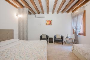 Ένα ή περισσότερα κρεβάτια σε δωμάτιο στο San Marco Suite - 5 min da San Marco