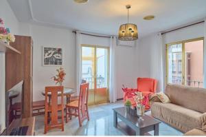 a living room with a couch and a table at CASA FILO VISTAS MONTAÑa in Rute