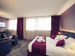 a hotel room with a bed and a desk at Mercure Saint Lô Centre in Saint Lo +37 photos