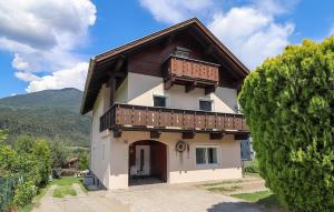 a house with a balcony on top of it at Apartment in Inzing in Inzing