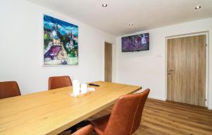 a conference room with a wooden table and chairs at Apartment in Inzing in Inzing