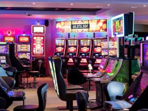 a casino with lots of slot machines at Pullman Cannes Mandelieu in Mandelieu-La Napoule