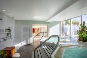 a bathroom with a jacuzzi tub in a house at Eurostars Atlántida in Santa Cruz de Tenerife +57 photos
