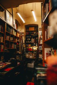 a room with bookshelves and shelves with books at Miiro Spittelberg NEW OPENING in Vienna