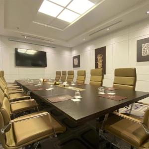 a large conference room with a large table and chairs at Three Points Al Salama in Jeddah