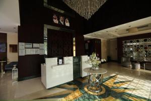a lobby with a table with flowers on it at Three Points Al Salama in Jeddah