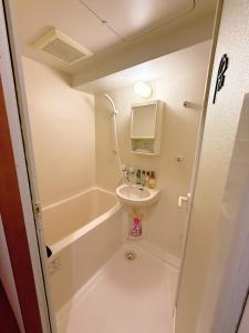 a small bathroom with a sink and a toilet at Wa Shinsaka 901 7minute walk from Shinsakacho Station in Nagoya