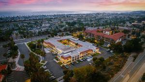 an overhead view of a large building in a city at Motel 6-Carlsbad, CA Beach in Carlsbad