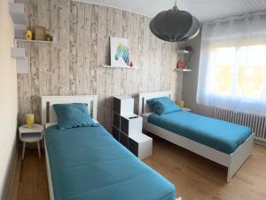 Postel nebo postele na pokoji v ubytování Maison 3 chambres à Lambres Lez Douai