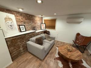 a living room with a couch and a coffee table at Charming Marmalade Flat in Downtown Salt Lake City in Salt Lake City