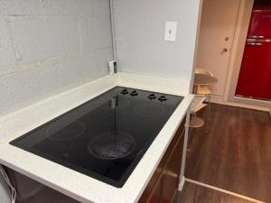 a kitchen with a stove top oven in a counter at Charming Marmalade Flat in Downtown Salt Lake City in Salt Lake City +23 photos