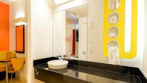 a bathroom with a sink and a mirror at Motel 6-San Diego, CA - Downtown in San Diego
