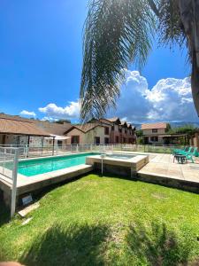 a swimming pool in front of a house at Complejo Abuela Lety in Merlo