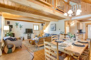 a dining room and living room with wooden ceilings at Mtn-View Deck Stunning Fraser Home By Ski Shuttle in Maryvale