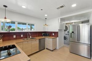a kitchen with a sink and a refrigerator at The Cowboy Social Unit 5 in Williams