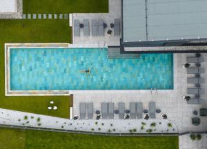 an overhead view of a swimming pool in a building at ELVA PREMIUM APARTMENT HOTEL inklusive Sommerpass STUBAI SUPER CARD in Neustift im Stubaital