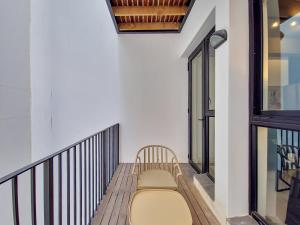 a bench sitting on top of a balcony at Brand new, luxury, wifi, pool with 24hr security in Cape Town