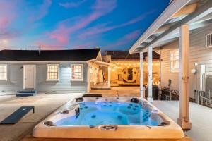a hot tub on the patio of a house at The Cowboy Social Unit 9 in Williams