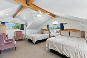 a bedroom with two beds and a ceiling fan at The Cowboy Social Unit 9 in Williams