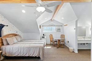 a bedroom with a bed and a ceiling fan at The Cowboy Social Unit 9 in Williams +24 photos