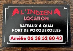 a sign for a restaurant with red crabs on it at Le Rafifou Porquerolles in Hyères +1 photo