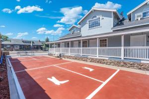 a tennis court in front of a house at The Cowboy Social Unit 10 in Williams