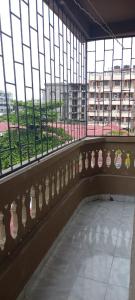 a building with large windows and a hallway with at Ekebute BnB in Mombasa +6 photos