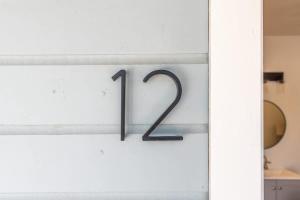 a glass door with the number on it at The Cowboy Social Unit 12 in Williams +20 photos