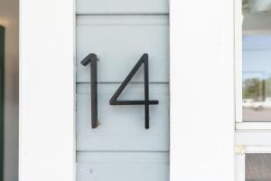 a sign on a door with the number four at The Cowboy Social Unit 14 in Williams