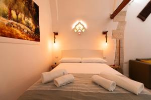 Postel nebo postele na pokoji v ubytování Carpe Diem - Dimora Rustica + 18 fotografií