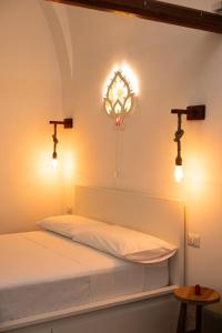 Postel nebo postele na pokoji v ubytování Carpe Diem - Dimora Rustica