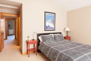 a bedroom with a bed and two end tables at Private Reserve 30 day minimum in Hood River