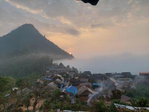 a view of a village with a mountain in the background at culture home home stay in Bandīpur