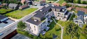 an aerial view of a large building in a city at Luxury Apartment Antwerp Port Moerbeke 1 in Lokeren