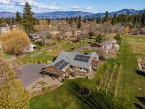 an aerial view of a house with solar panels on it at Quail On Sunset in Hood River