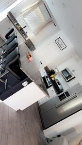 an overhead view of a living room with a kitchen at North Fontana pool house in Fontana