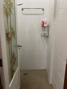 a bathroom with a shower with a glass door at kubu home stay in Ban Ko Sawat +40 photos