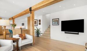 a living room with a flat screen tv on a wall at Private Aspen Haven Views in Woody Creek