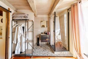 a room with a glass shelf and a window at Cocon avec jacuzzi in Labastide-de-Juvinas +27 photos