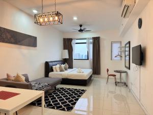 a living room with a bed and a couch at Chambers Suites Kuala Lumpur by AFA in Kuala Lumpur