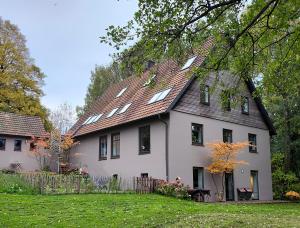a large white house with a gambrel roof at Landschule Rhön in Poppenhausen +39 photos
