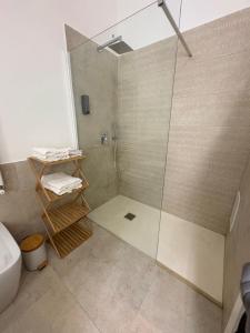 a bathroom with a shower and a toilet and a sink at Moonlight Drive in Cava deʼ Tirreni