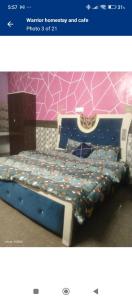 Postel nebo postele na pokoji v ubytování Warrior Homestay And Cafe