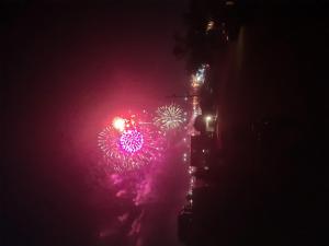 a firework display at night in a city at Hazel House in Saint Ignace