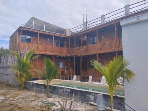 a house on the beach with a swimming pool at Selva y Mar in Holbox Island
